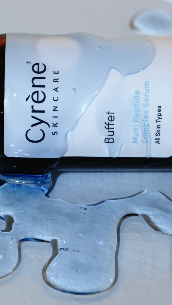Cyrène Buffet Multi Peptide serum bottle with a close-up of its blue gel texture