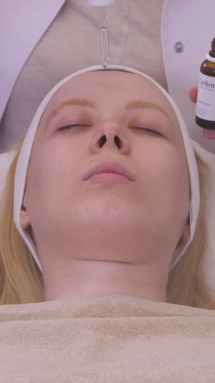 Cyrène C E Ferulic serum being applied to the face in a skincare demonstration