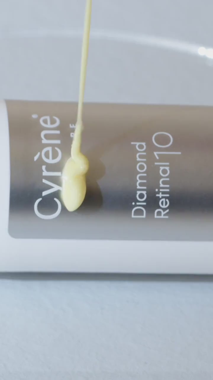 Close-up of Cyrène Diamond Retinal 10 serum texture beside its 0.1% retinal bottle